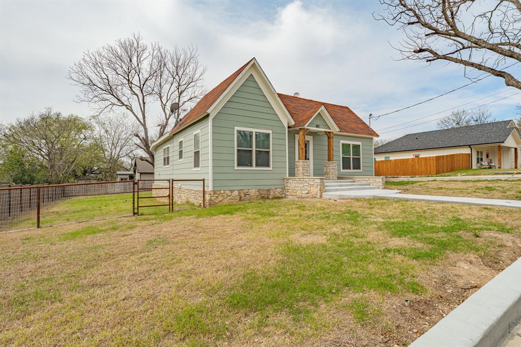 412 North Kirk Street Hico, TX 76457 - Photo 3 of 25 a front view of a house with a yard
