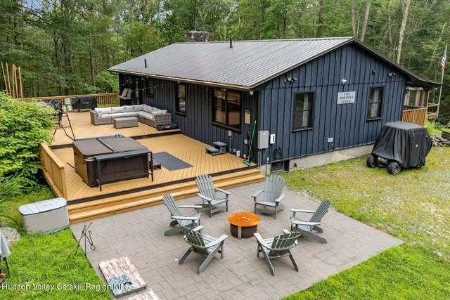 a kitchen with a sink dining table and chairs