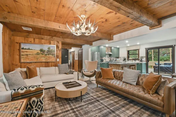 a view of a swimming pool with an outdoor space and seating area