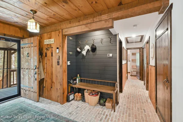 a backyard of a house with plants and wooden fence