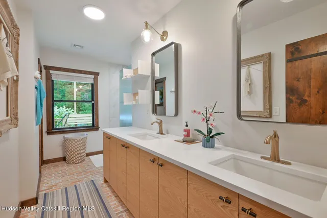 an aerial view of a house with a yard and lake view