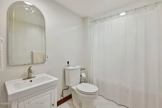 a view of house with yard and outdoor seating