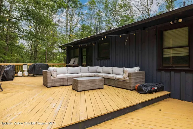 a bathroom with a sink toilet vanity and shower