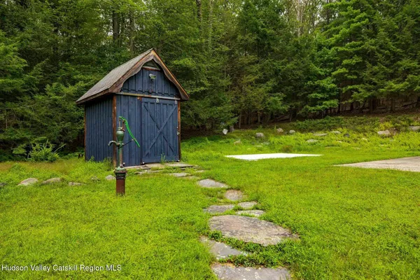 a view of a back yard from a room