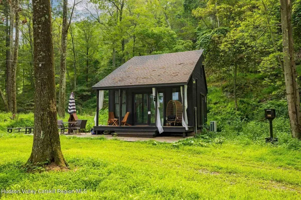 a view of a backyard with sitting area