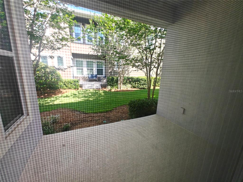 8075 Schelling Street Orlando, FL 32827 - Photo 12 of 51 a view of outdoor space with garden