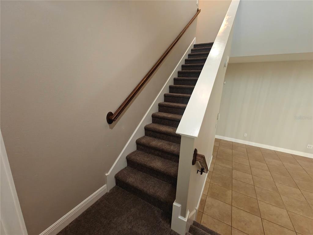 8075 Schelling Street Orlando, FL 32827 - Photo 18 of 51 a view of entryway with wooden floor
