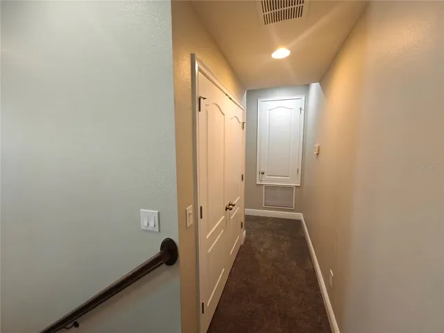 a view of a hallway with windows