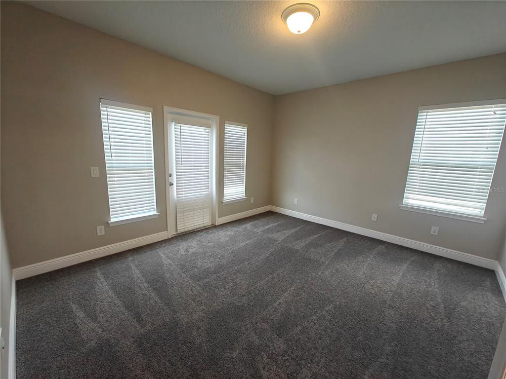 8075 Schelling Street Orlando, FL 32827 - Photo 26 of 51 an empty room with windows