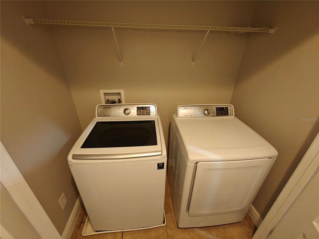 8075 Schelling Street Orlando, FL 32827 - Photo 43 of 51 a utility room with dryer and washer