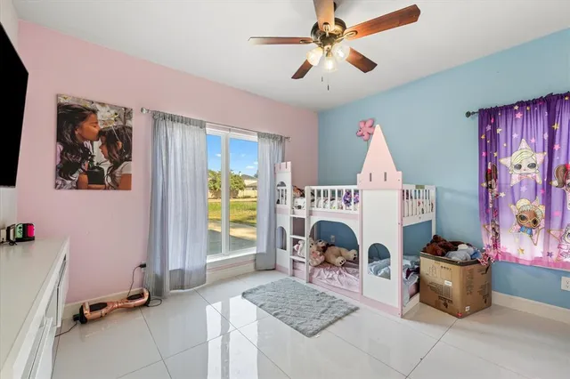 a living room with furniture a window and a fireplace