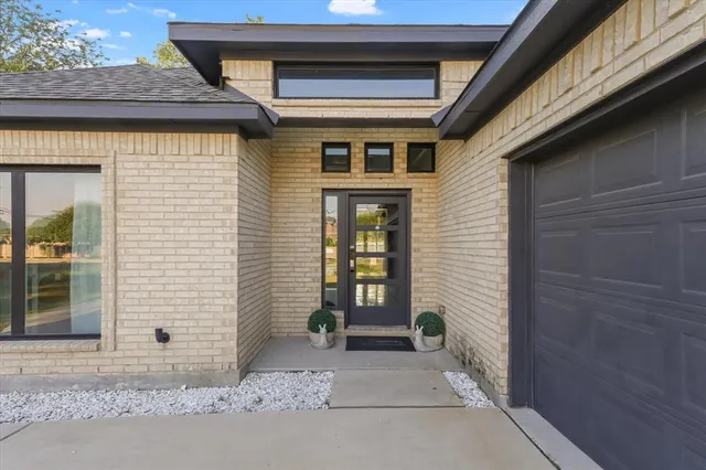 a front view of a house with a glass door