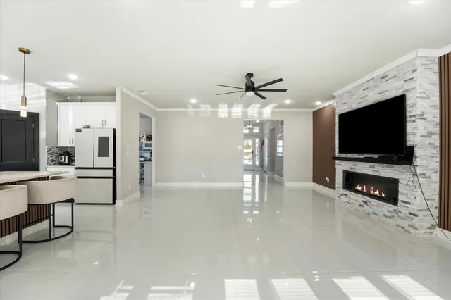 a view of a livingroom with furniture and a flat screen tv