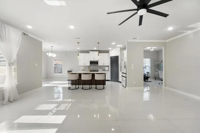 a view of kitchen with refrigerator and window