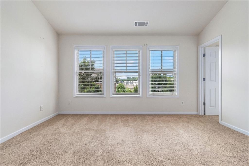 3656 Chicago Street Northwest Suwanee, GA 30024 - Photo 14 of 26 an empty room with a window