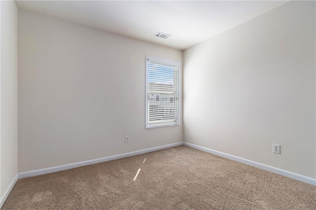 3656 Chicago Street Northwest Suwanee, GA 30024 - Photo 18 of 26 a view of an empty room with a window
