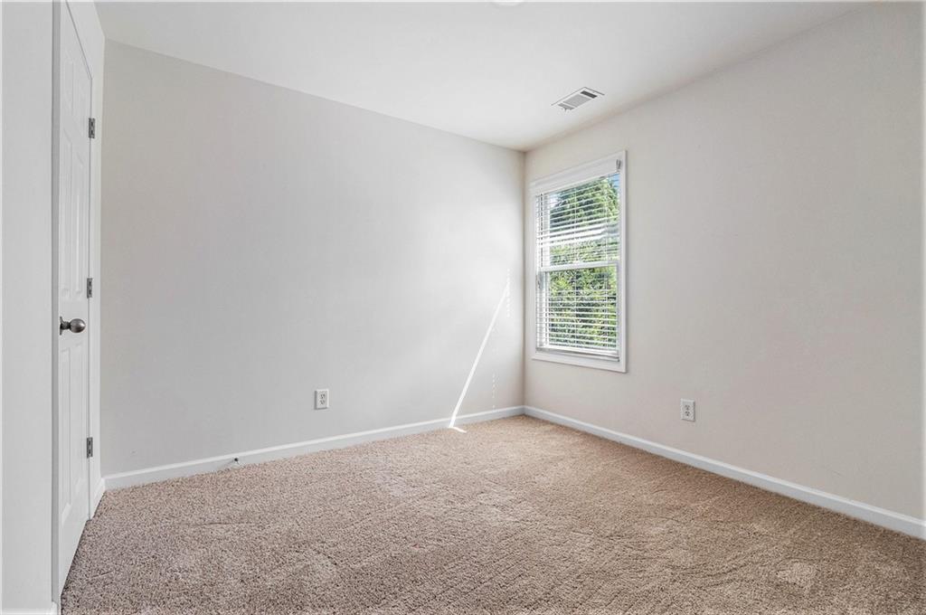 3656 Chicago Street Northwest Suwanee, GA 30024 - Photo 19 of 26 a view of an empty room with a window