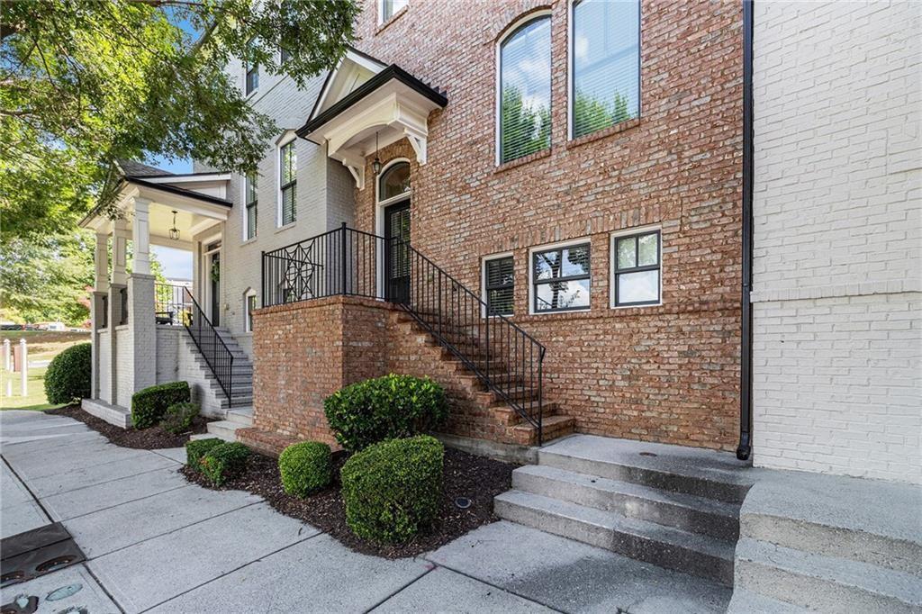 3656 Chicago Street Northwest Suwanee, GA 30024 - Photo 2 of 26 a front view of a house with a yard