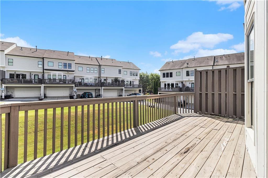 3656 Chicago Street Northwest Suwanee, GA 30024 - Photo 22 of 26 a view of a balcony with wooden floor