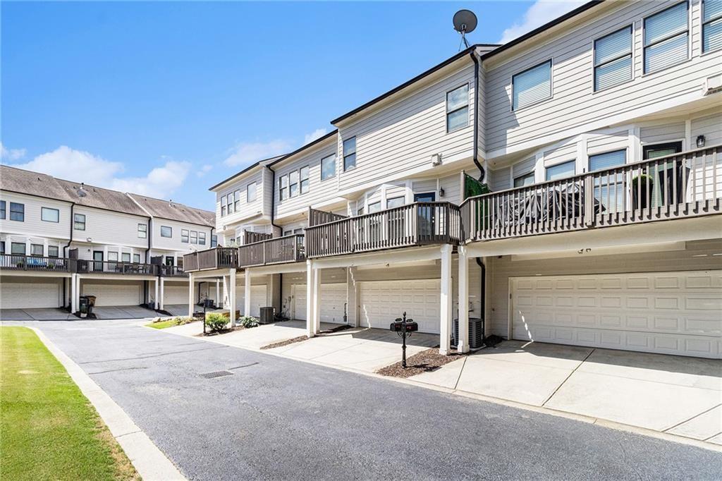 3656 Chicago Street Northwest Suwanee, GA 30024 - Photo 24 of 26 a view of a building with a patio