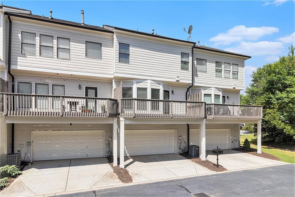 3656 Chicago Street Northwest Suwanee, GA 30024 - Photo 25 of 26 a front view of a house with parking