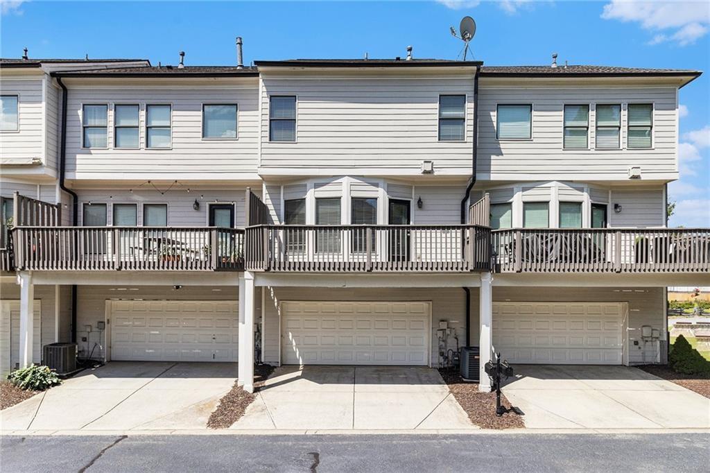 3656 Chicago Street Northwest Suwanee, GA 30024 - Photo 26 of 26 a front view of a house with a garage
