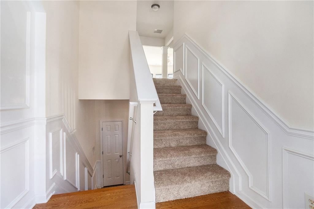 3656 Chicago Street Northwest Suwanee, GA 30024 - Photo 5 of 26 a view of entryway and hall with wooden floor