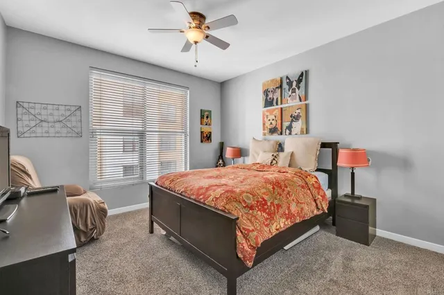 a bedroom with a bed dresser and a window