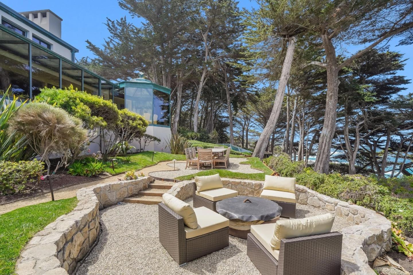 157-163 Spindrift Road Carmel, CA 93923 - Photo 77 of 100 a view of a patio with couches and a fire pit