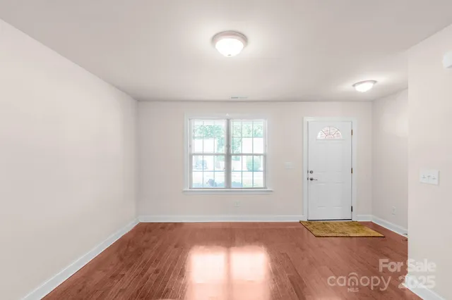 a view of an empty room and window