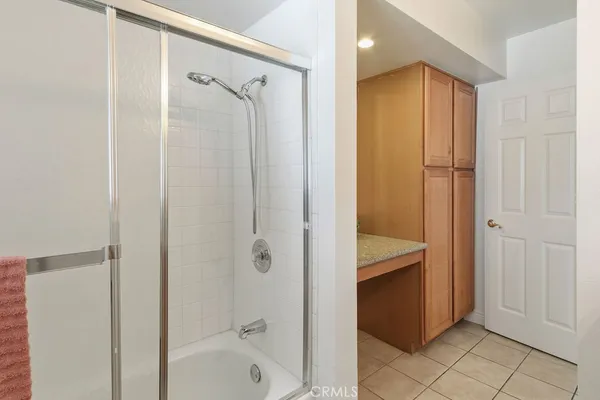 a bathroom with a shower and a tub