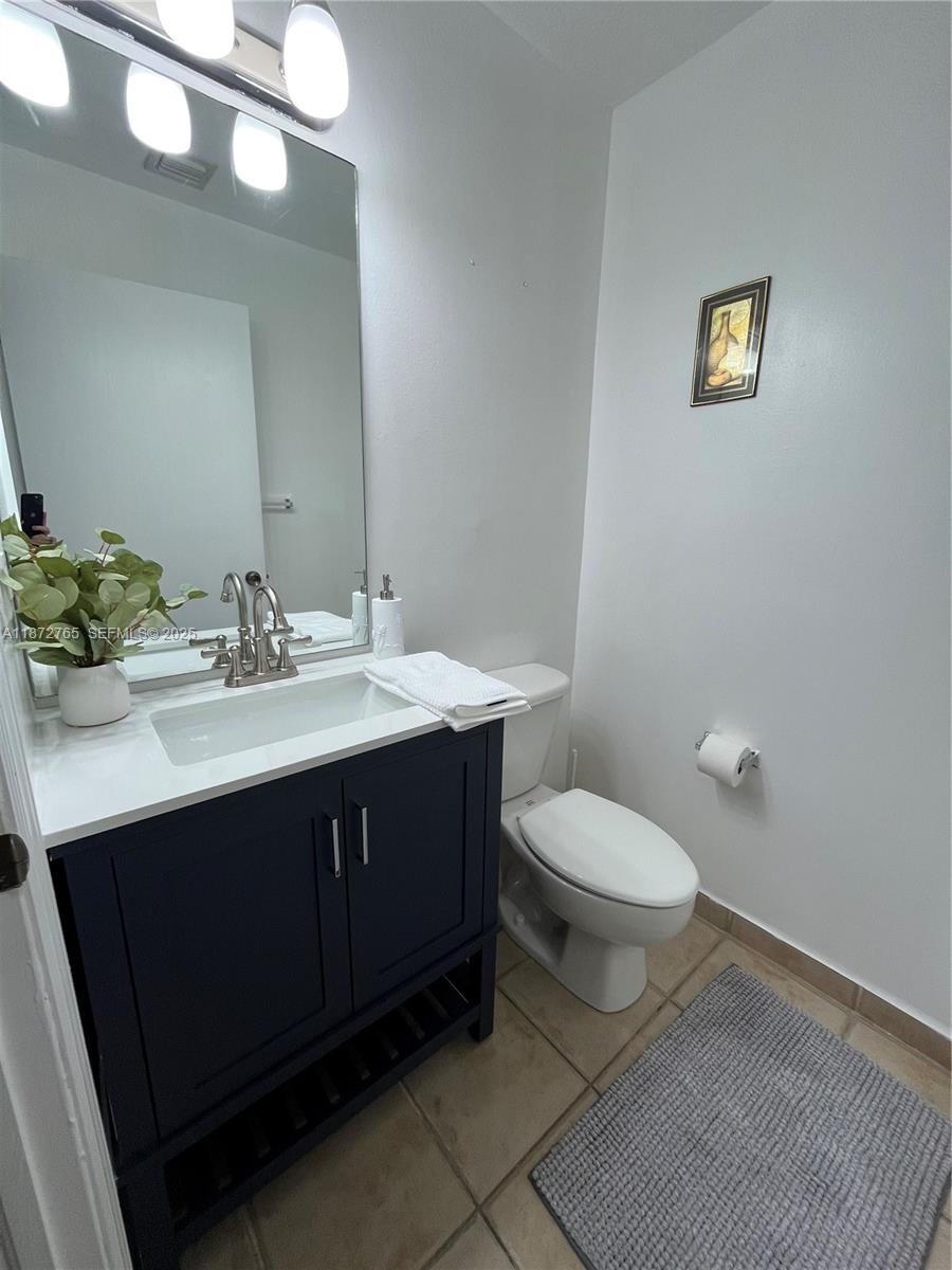 603 Southwest 107th Avenue, Unit 1701 Pembroke Pines, FL 33025 - Photo 15 of 41 a bathroom with a sink vanity and toilet