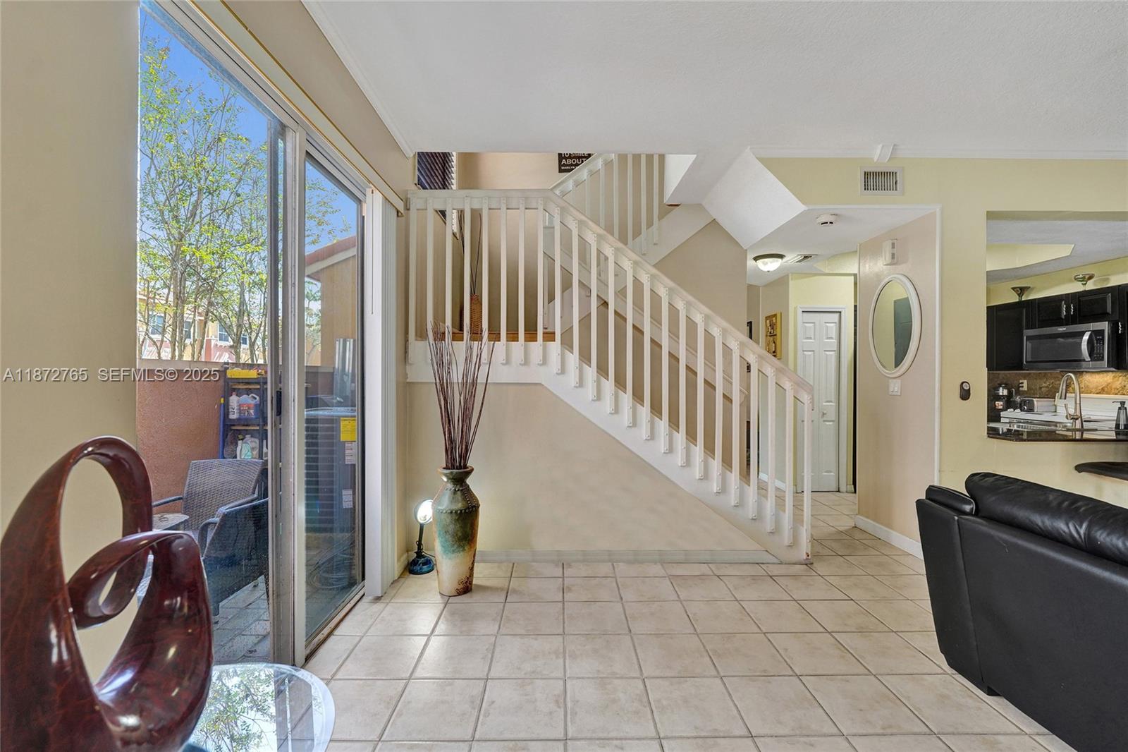 603 Southwest 107th Avenue, Unit 1701 Pembroke Pines, FL 33025 - Photo 18 of 41 a view of an entryway with seating area