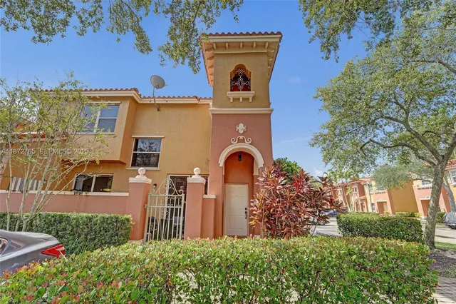 a view of a dining room with furniture and a chandelier