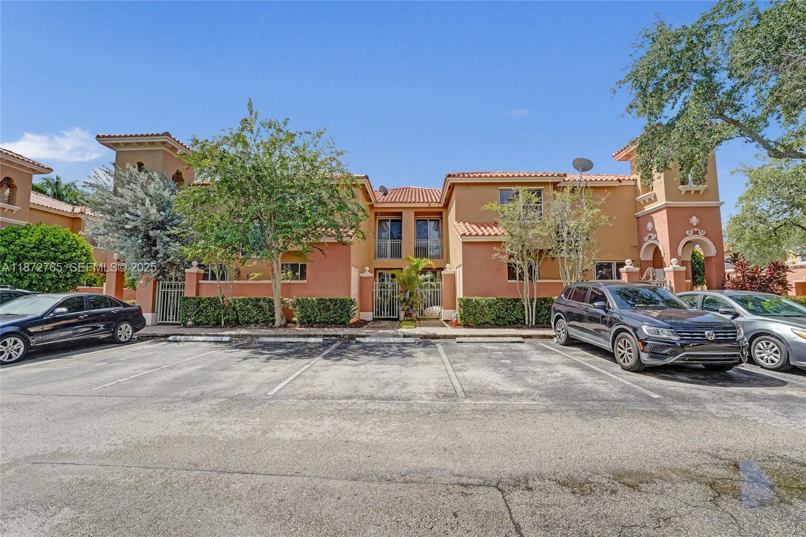 603 Southwest 107th Avenue, Unit 1701 Pembroke Pines, FL 33025 - Photo 39 of 41 a car parked in front of a house