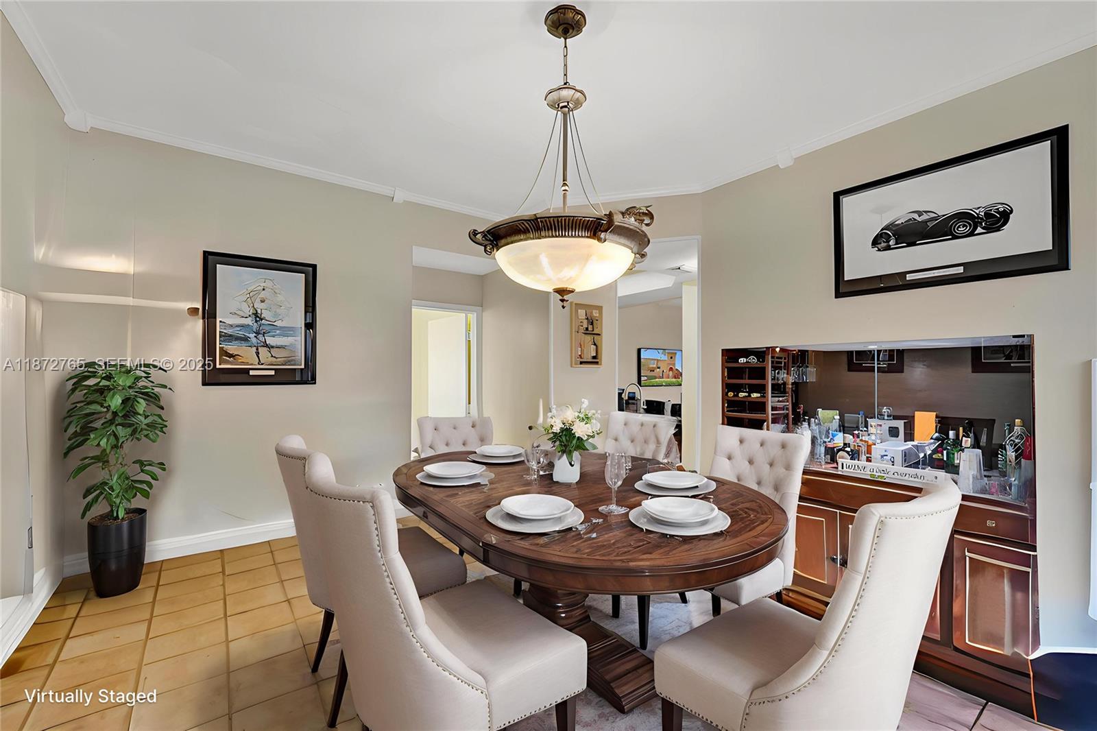 603 Southwest 107th Avenue, Unit 1701 Pembroke Pines, FL 33025 - Photo 4 of 41 a view of a dining room with furniture and a chandelier