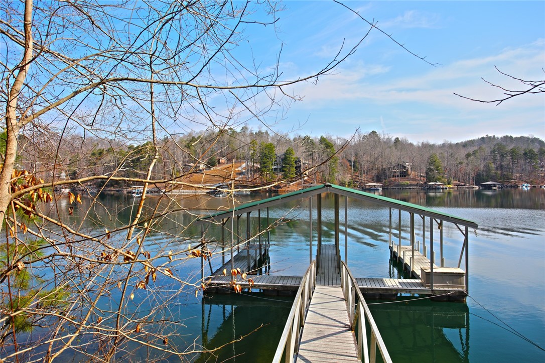 Lot 5 Royal Reserve Sunset, SC 29685 - Photo 23 of 50 This serene lakeside property features a private covered boat dock with direct water access.
