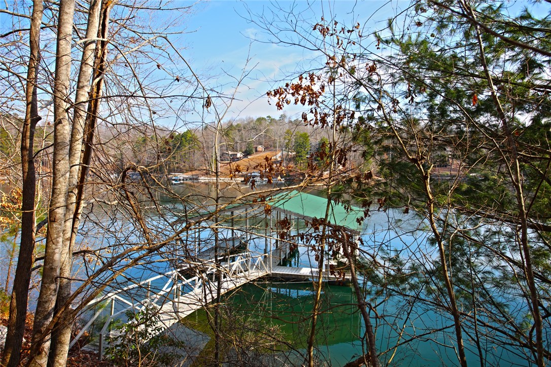 Lot 5 Royal Reserve Sunset, SC 29685 - Photo 26 of 50 This serene waterfront property features a private dock, offering direct access to the lake.