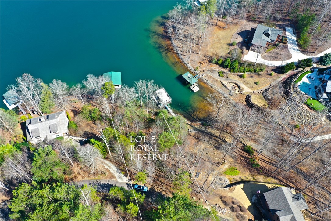 Lot 5 Royal Reserve Sunset, SC 29685 - Photo 3 of 50 This aerial view showcases a waterfront lot nestled amongst mature trees, offering serene natural beauty.