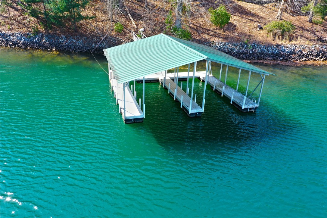 Lot 5 Royal Reserve Sunset, SC 29685 - Photo 9 of 50 This serene lakefront property includes a private covered dock for waterside enjoyment.