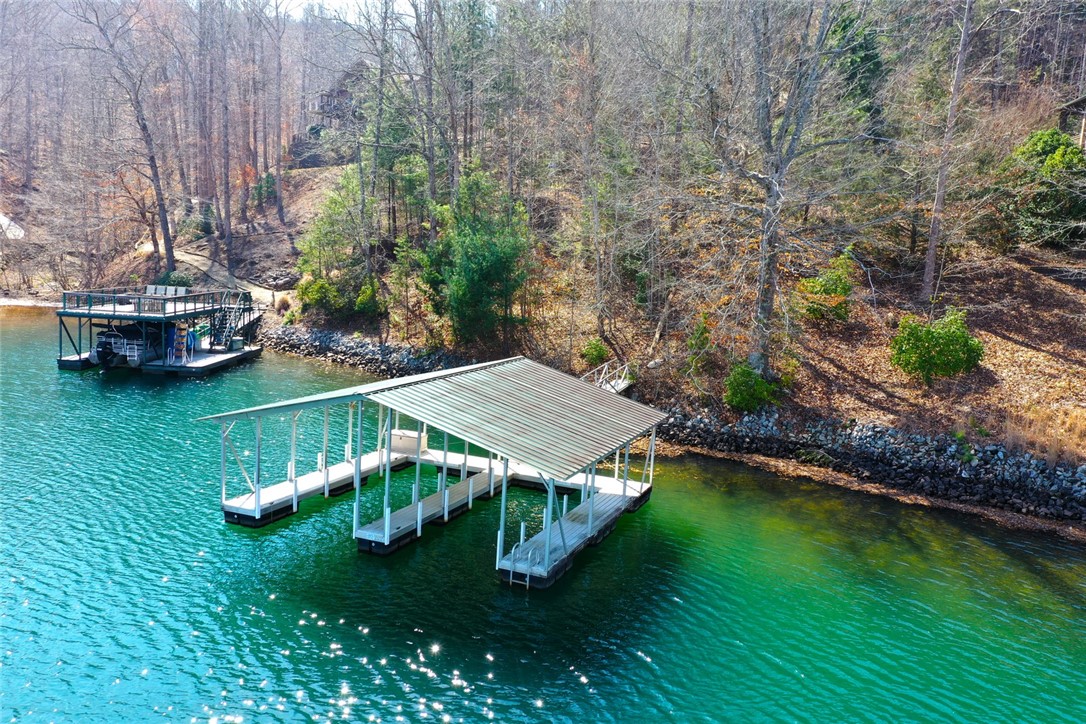 Lot 5 Royal Reserve Sunset, SC 29685 - Photo 10 of 50 This serene lakefront property includes multiple docks for convenient water access and leisure.