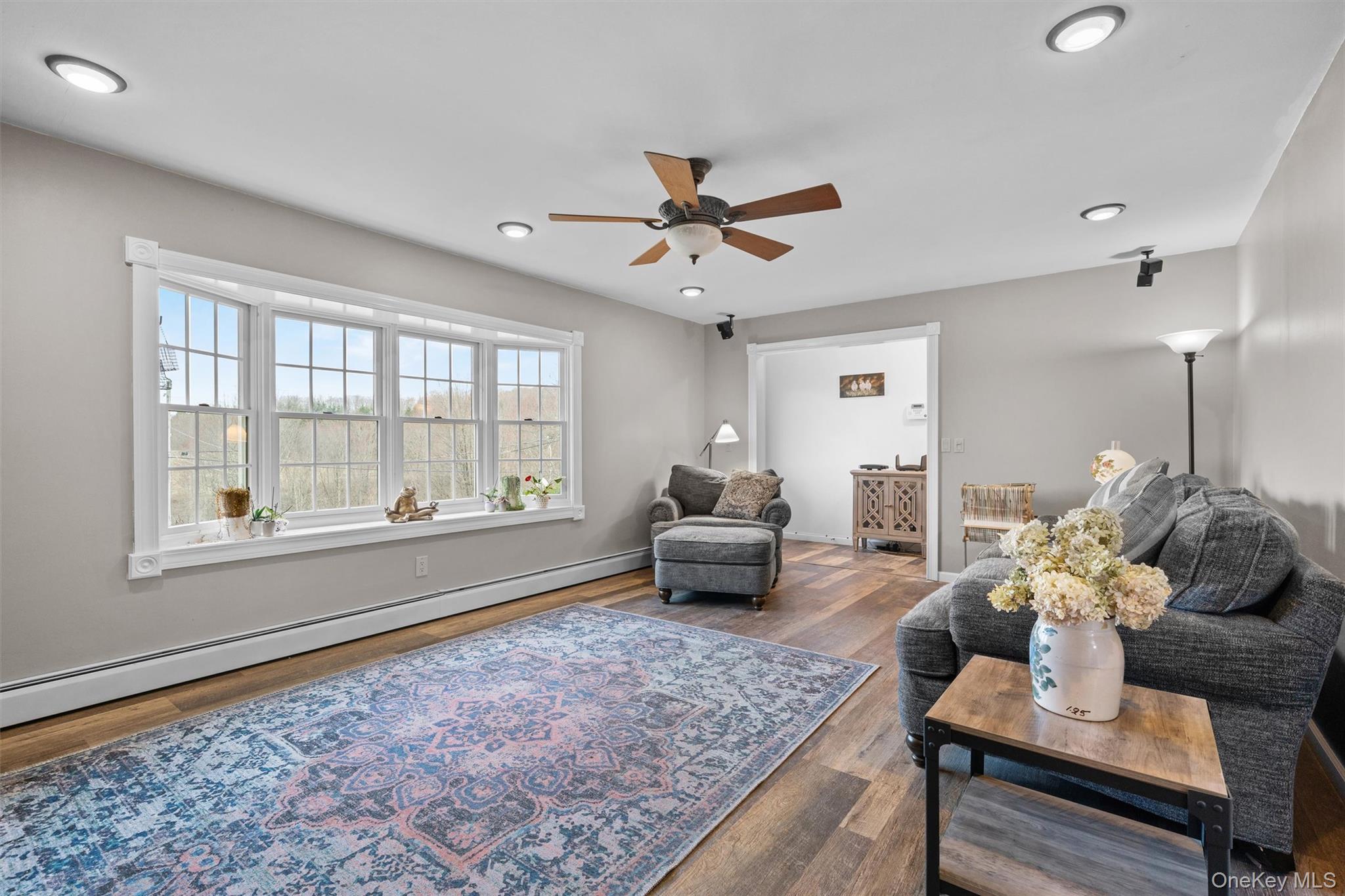 5 Hess Road Callicoon, NY 12723 - Photo 11 of 45 a living room with furniture and a floor to ceiling window