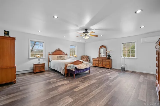 a bedroom with bed and window