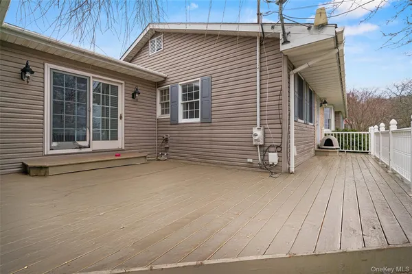 a view of a house with backyard and porch
