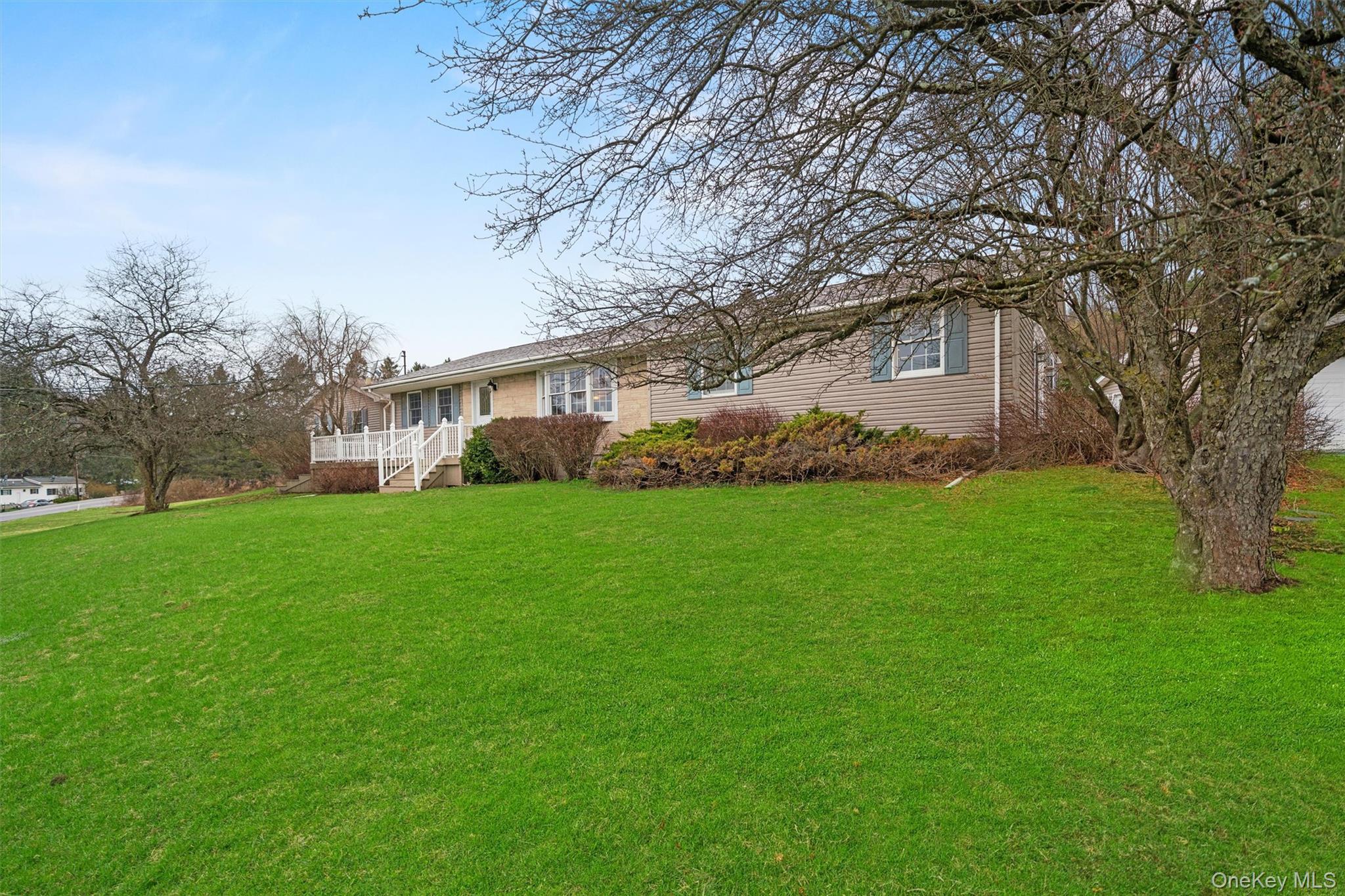 5 Hess Road Callicoon, NY 12723 - Photo 4 of 45 a white house with a big yard and large trees