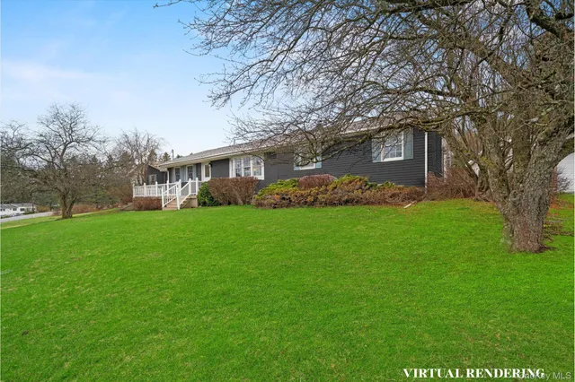 a front view of house with yard and green space