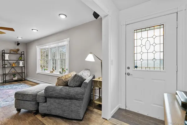 a living room with furniture and a window