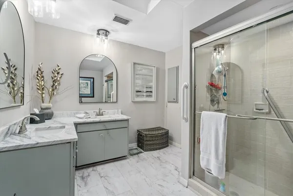a bathroom with a granite countertop sink a large mirror and a