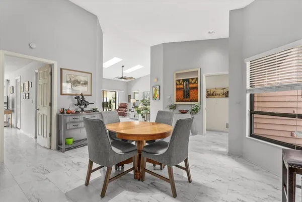 a dining room with furniture and window