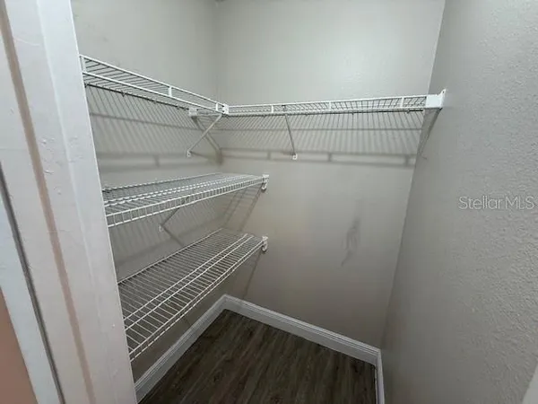 a view of a room with racks on the wall